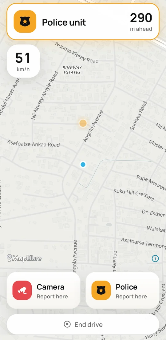 Qlotela while driving: a police unit 290 metres ahead, the car at 51 km/h, and buttons to report a camera or police.